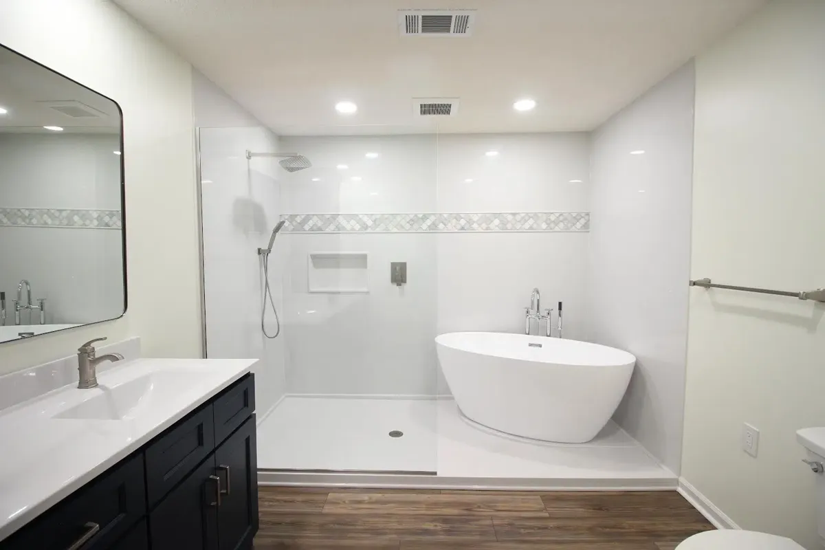 Large white gloss wall panels around a curbless shower and freestanding tub